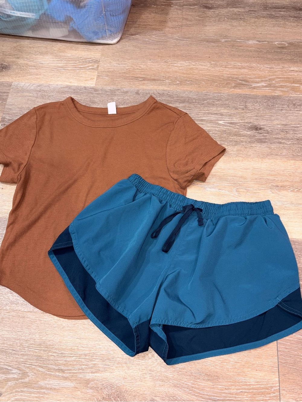 Outfit lined Teal Blue Athletic Drawstring Shorts and active tee curved hem